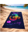 Serviette de plage lézard multicolore sur fond bleu, en 100% coton tissage jacquard 90x70cm sur la plage